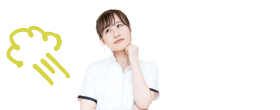 頬に手を当てて悩む女性スタッフ